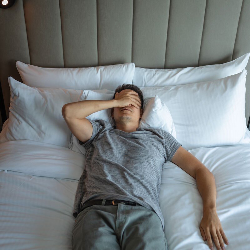 man in bed with insomnia