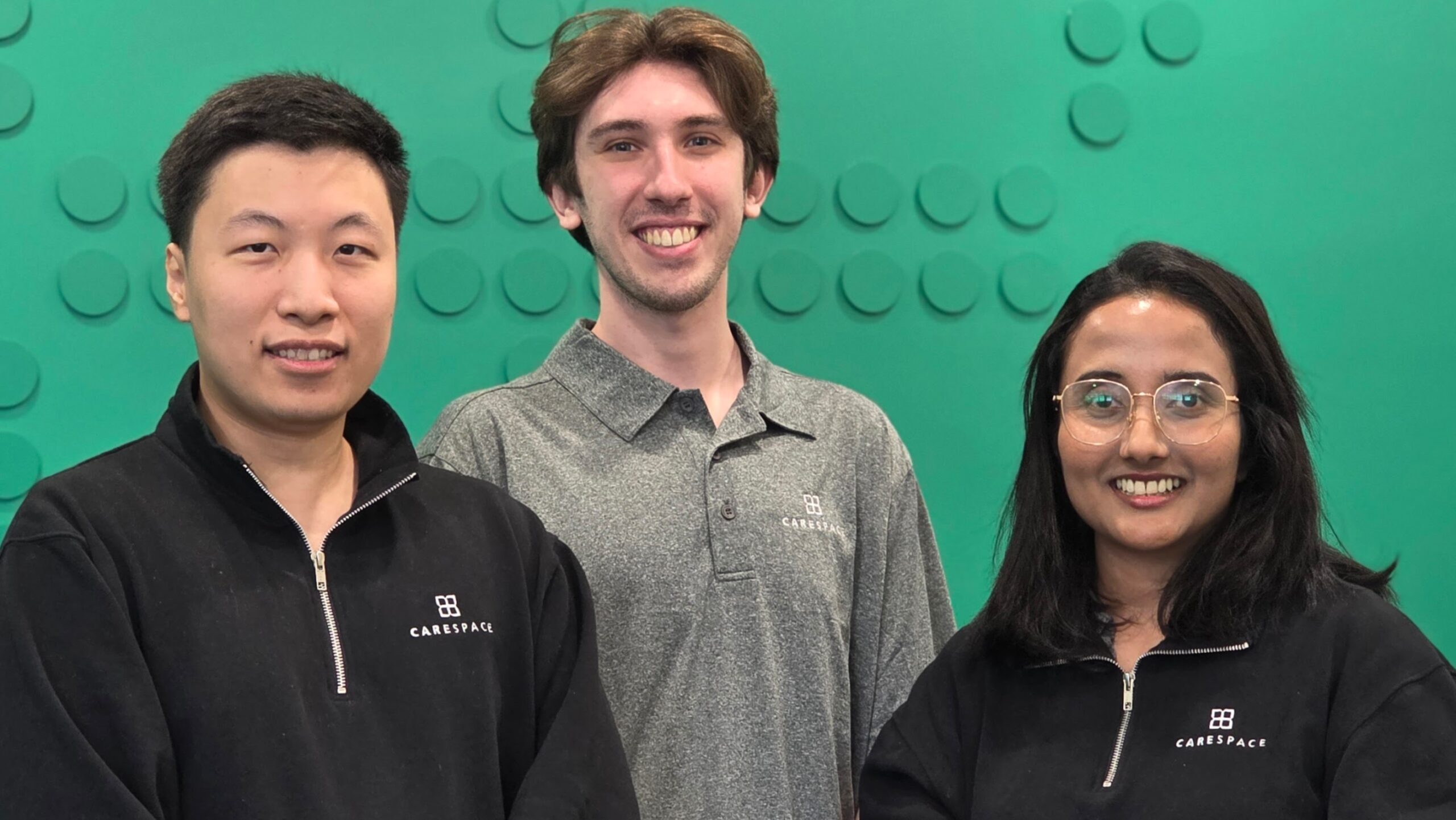 a counsellor, dietitian and a physiotherapist standing together in the carespace fischer-hallman location in kitchener