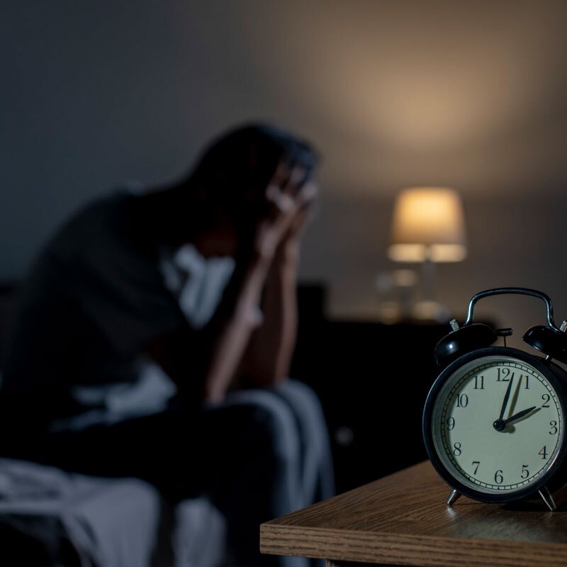 man struggling with sleep disorders