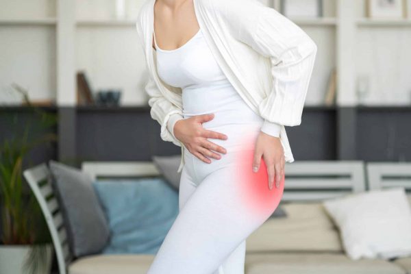 woman suffering from femoroacetabular impingement (FAI) pain