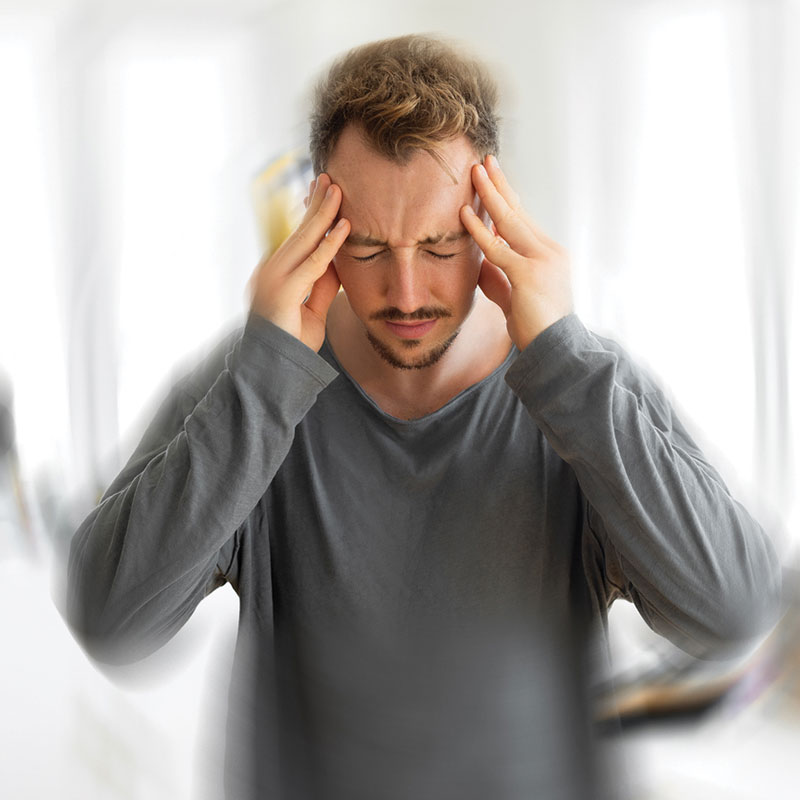man displaying signs of dizziness