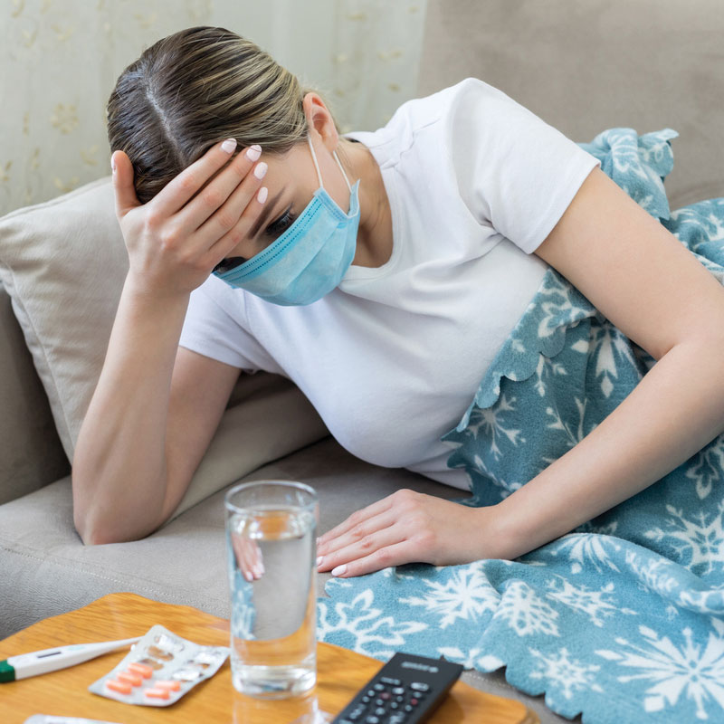 woman on couch with immune weakness