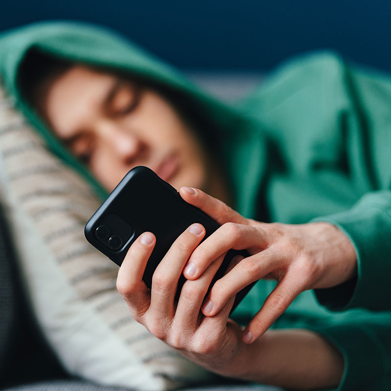 man on phone showing addictions and compulsions